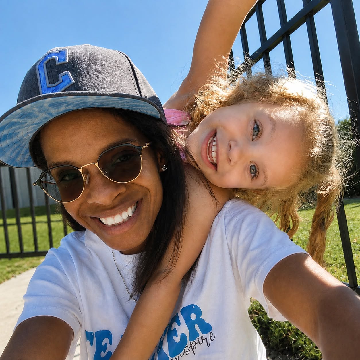 Ms. Brittanie sharing a joyful outdoor moment with a Wild Roots child