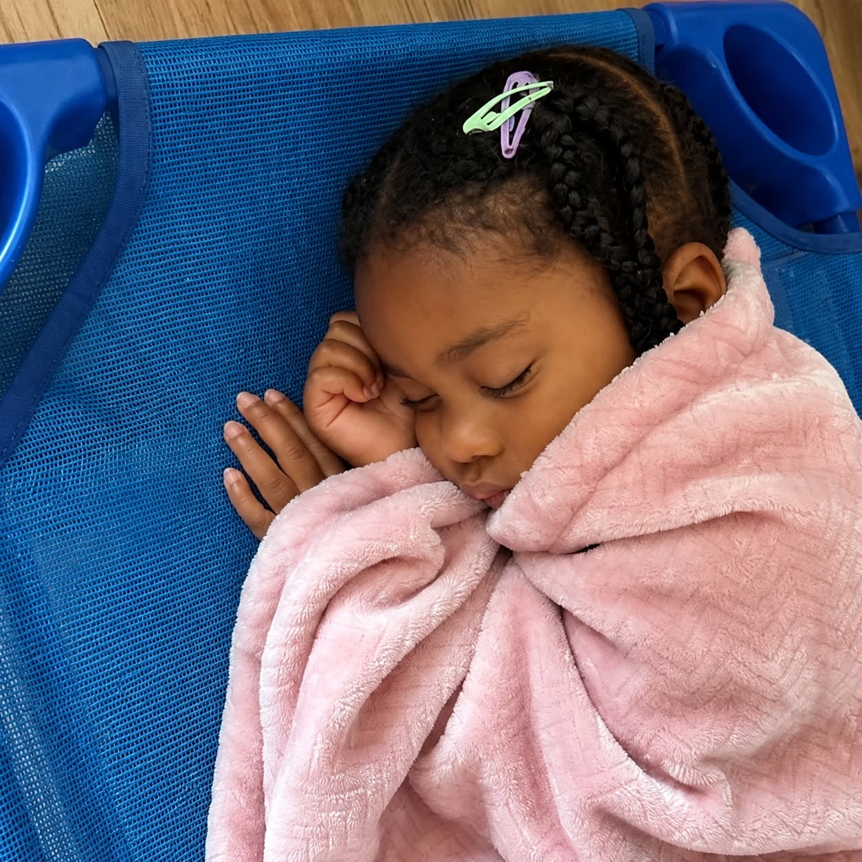 A young Wild Roots learner resting peacefully